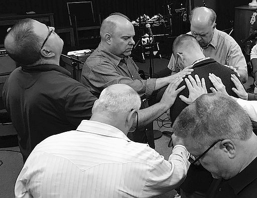 Men's Connect group in prayer.